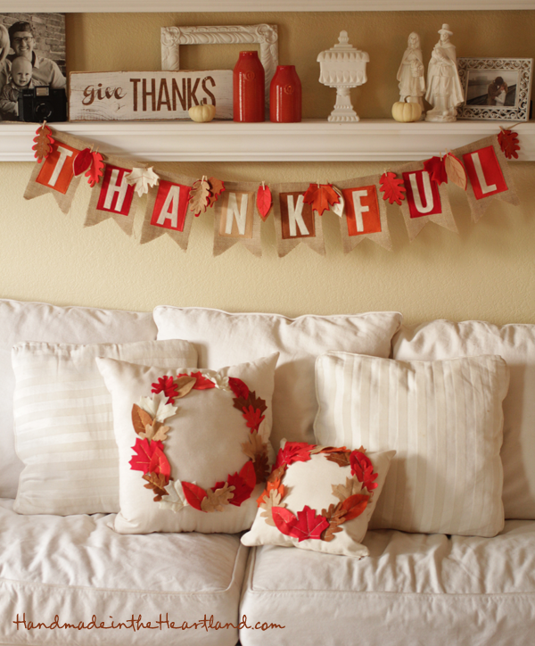 With a banner and a pillow you probably already have, you can make a perfectly festive mantel.